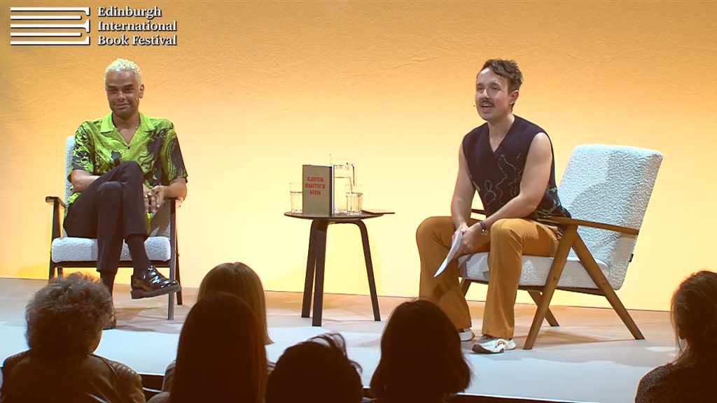 Kevin in conversation with the author Raven Smith, both sat in chairs against a yellow background.